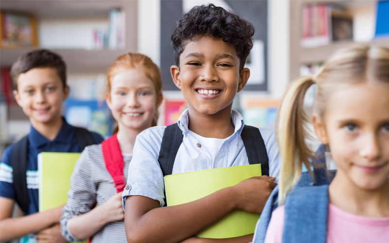 Elementary Kids smiling at the camera