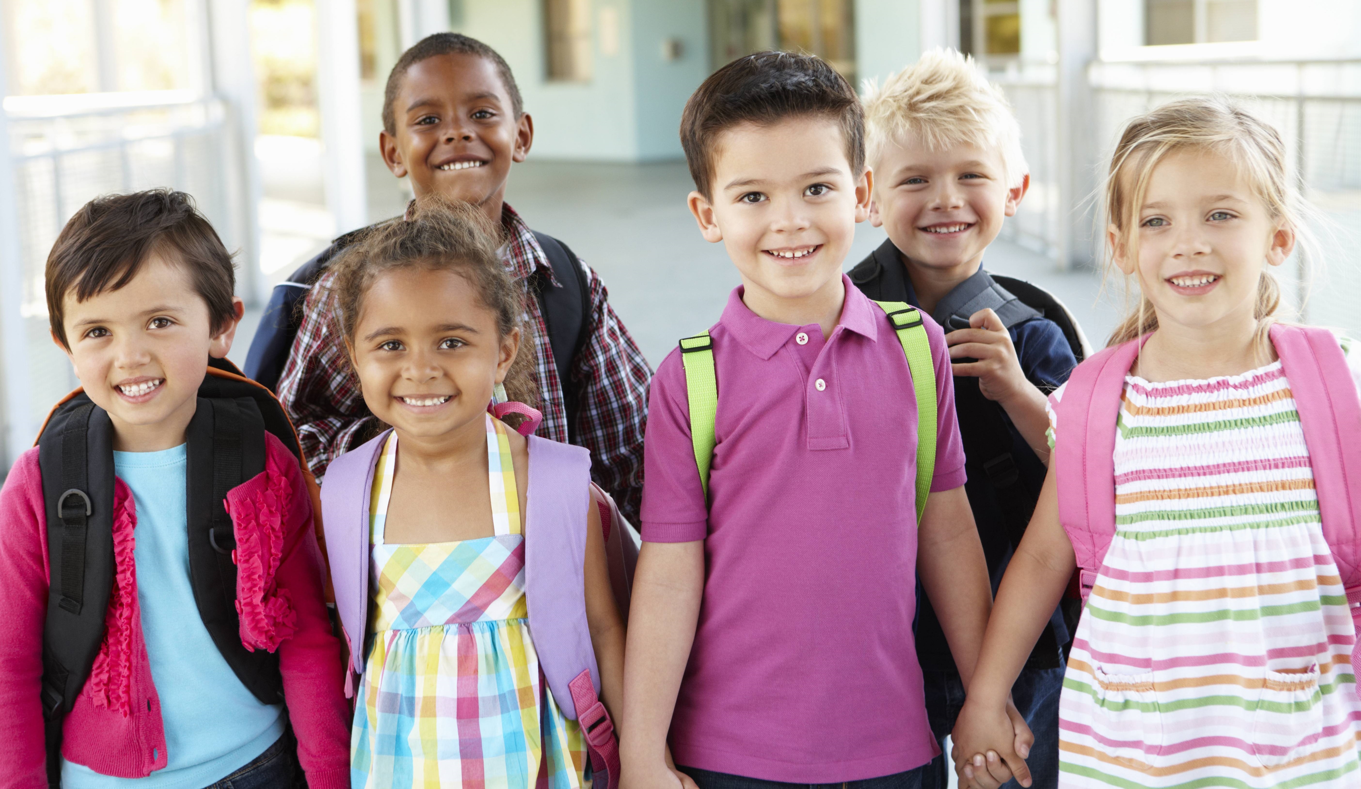 elementary students holding hands