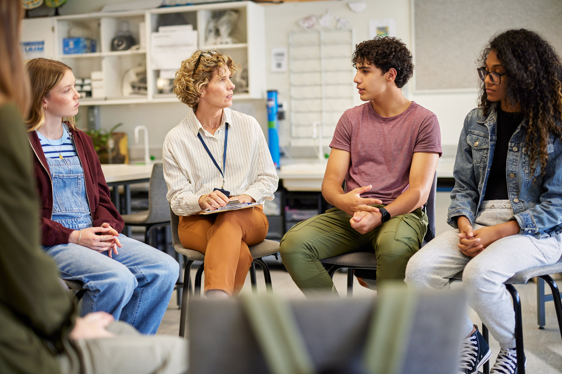 Suicide Awareness Discussion Photo of a teacher with students in a group discussion